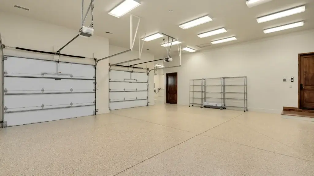 Full-flake epoxy garage floor coating in a three-car garage in Colorado Springs